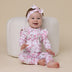 Toddler wearing Cherry Blossom Organic Snugglesuit Convertible Romper with Frill | Snuggle Hunny