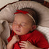 Baby wearing Red Velvet Bow | Snuggle Hunny