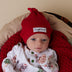 Baby wearing Red Ribbed Organic Knotted Beanie | Snuggle Hunny