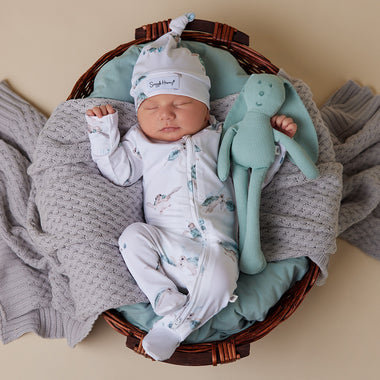 Baby wearing Turtle Organic Snuggle Sleepsuit Zip Footie | Snuggle Hunny